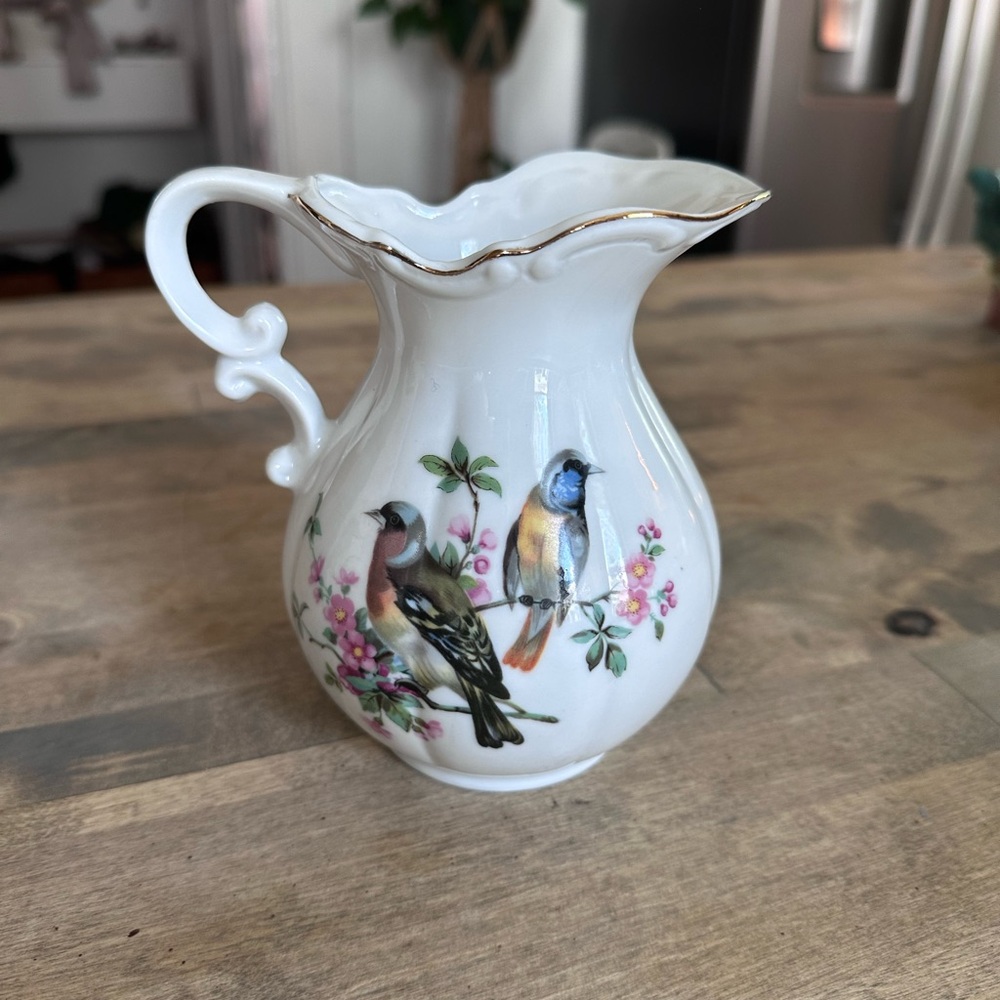 Vintage porcelain vase bird motif